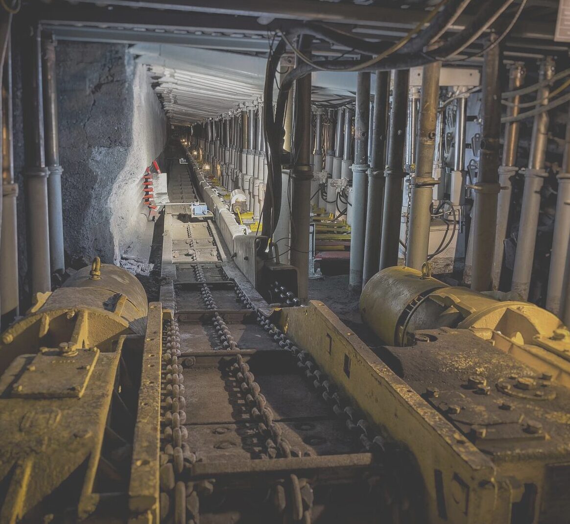 Underground mine roadway with conveyor and hydraulic support equipment installed